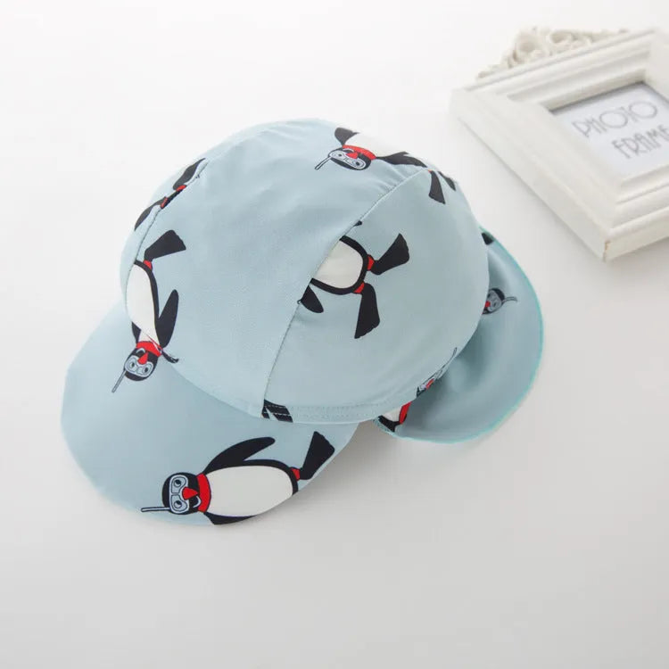 Boys' penguin print one-piece swimsuit with long sleeves and matching swimming cap for children aged 2-7 years