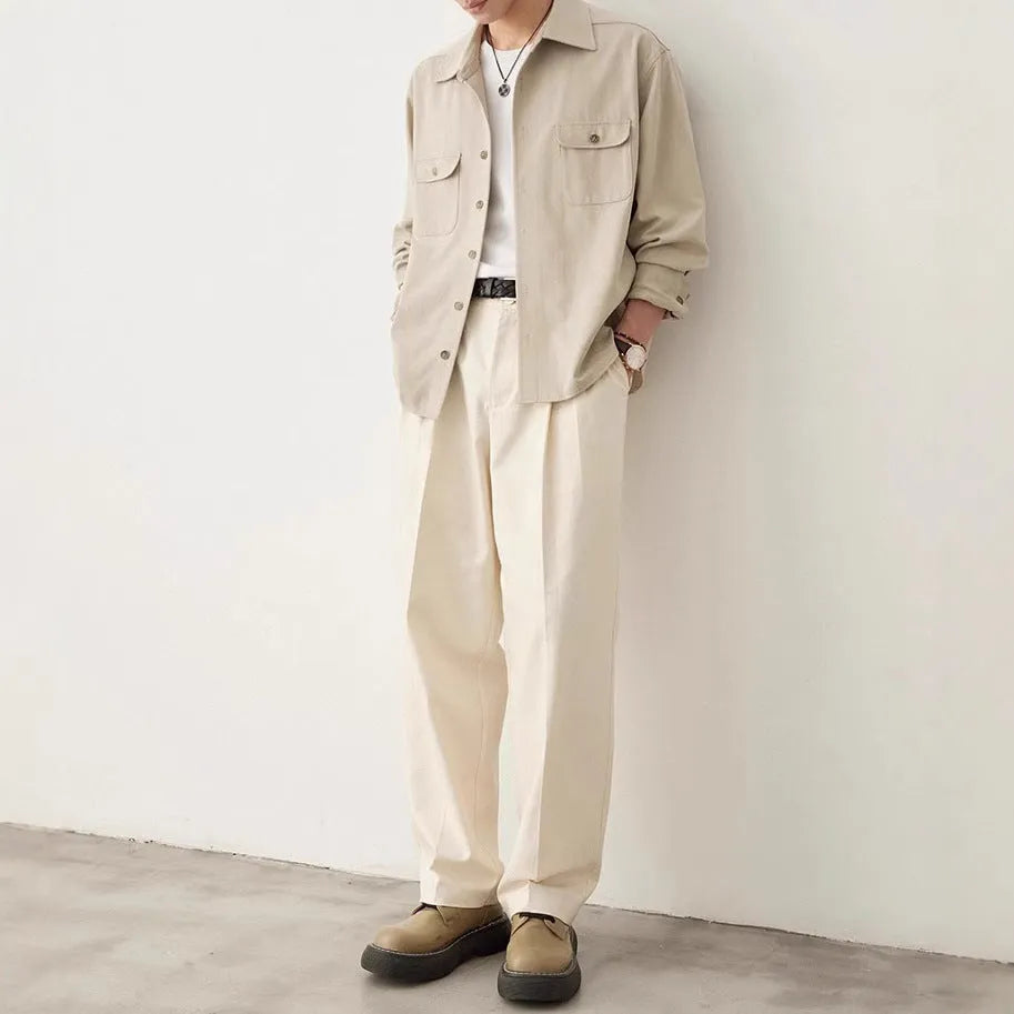 Men's light sand rice coloured long sleeve shirt with a simple lapel, laid flat.