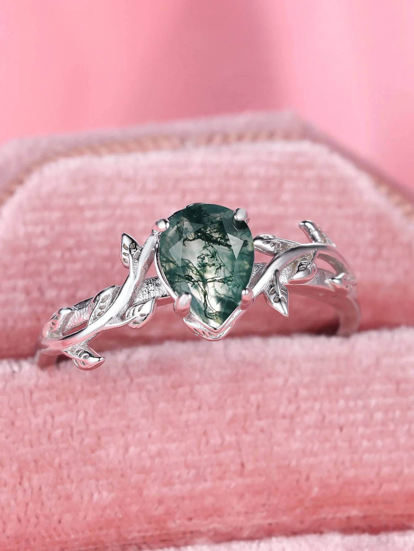 S925 silver drop-shaped agate edge branch leaf ring on white background, sterling silver band with natural stone