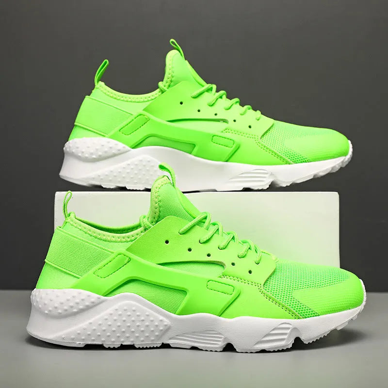 Men's casual low top shoes with mesh upper in fluorescent red colour showing round toe and lace-up design