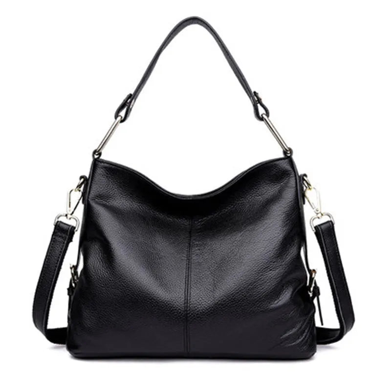 Genuine leather vertical square crossbody bag in black colour with visible stitching and multiple compartments.