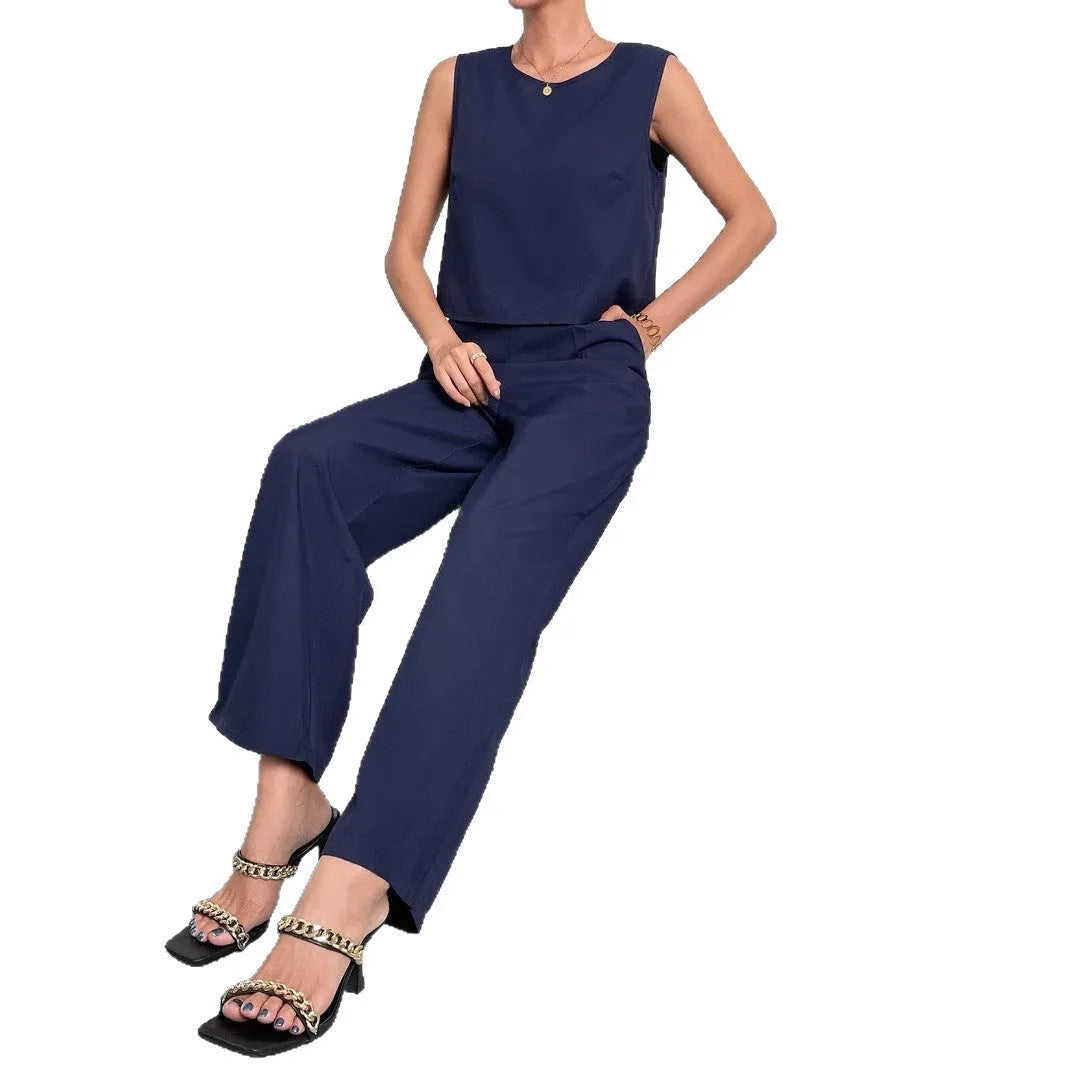 Red women's sleeveless top and wide leg trousers two-piece co-ord set on a hanger