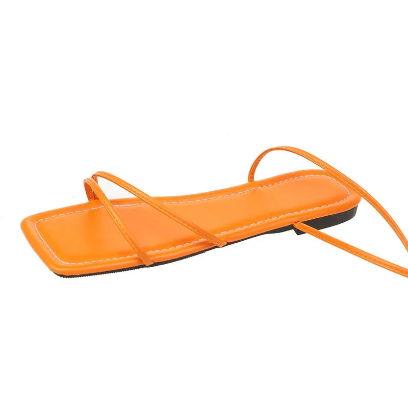 Women's flat sandals with ankle ring bandage cloth, square toe, and front lace-up fastening in black.