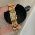 Women's mid-century bracelet watch with 15mm dial, mineral glass, and butterfly buckle in gold or silver options