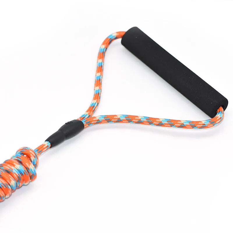 Pet climbing harness in blue nylon with foam handle and circular rope, laid flat