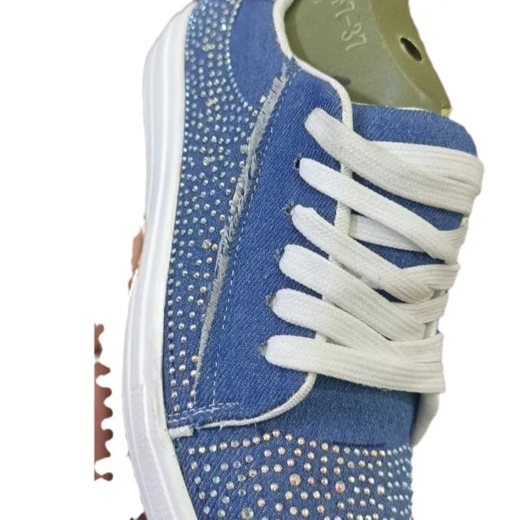 Plus size women's black lace-up casual shoes with rhinestone detail on the round toe and a thick rubber sole.