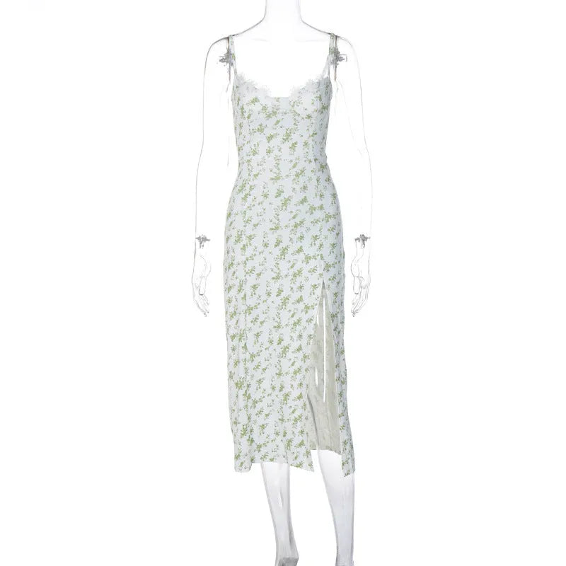 Blue lace flowers print long dress on a mannequin, showing side slit and suspender straps.