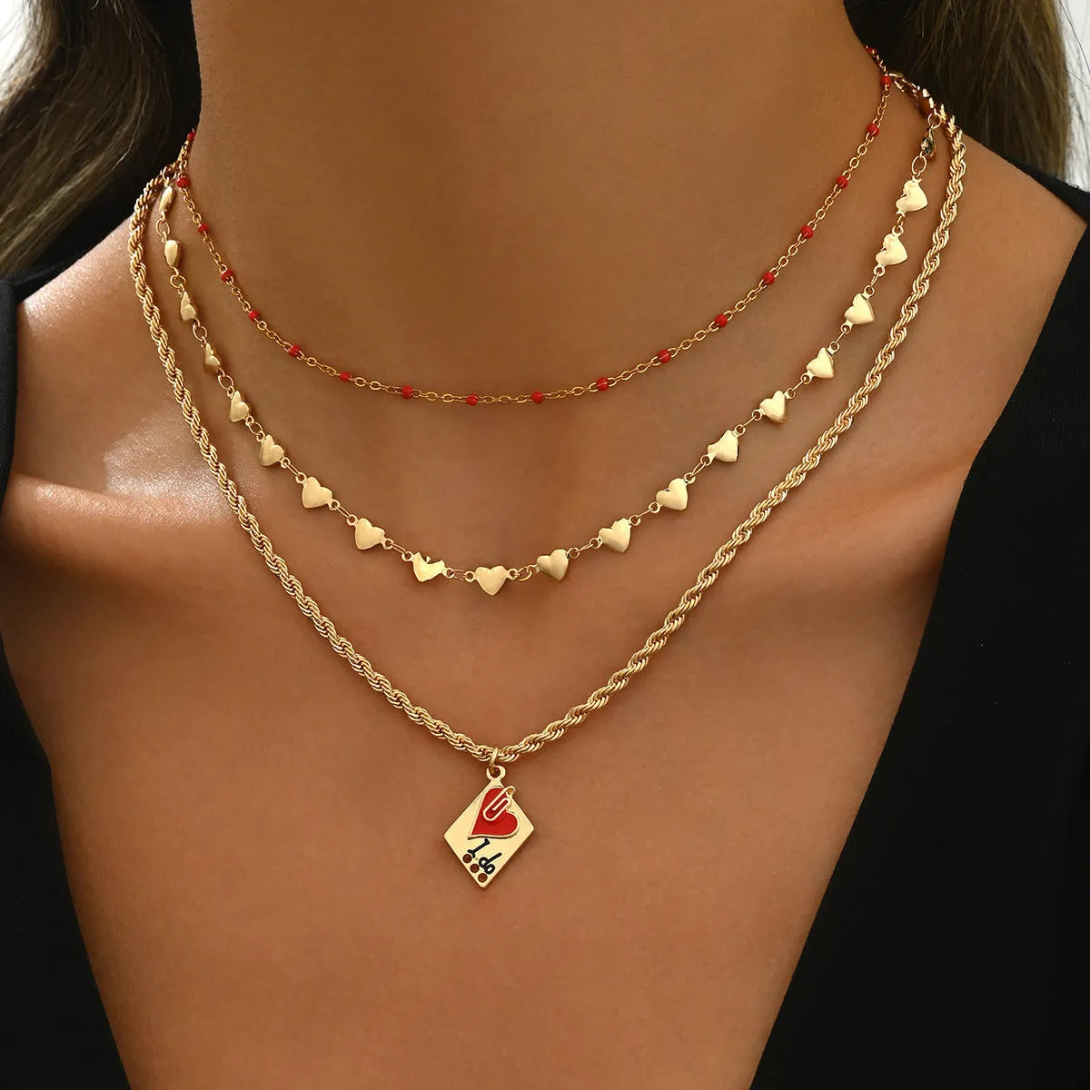 Silver adjustable three-layer clavicle chain necklace with a geometric love pendant.
