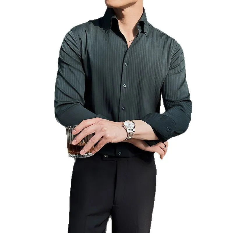 Man wearing a dark striped V-neck long sleeve casual shirt in a cardigan style.