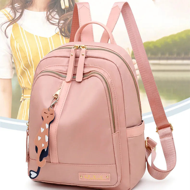 Women's soft nylon casual backpack in black colour with double shoulder straps and external pockets