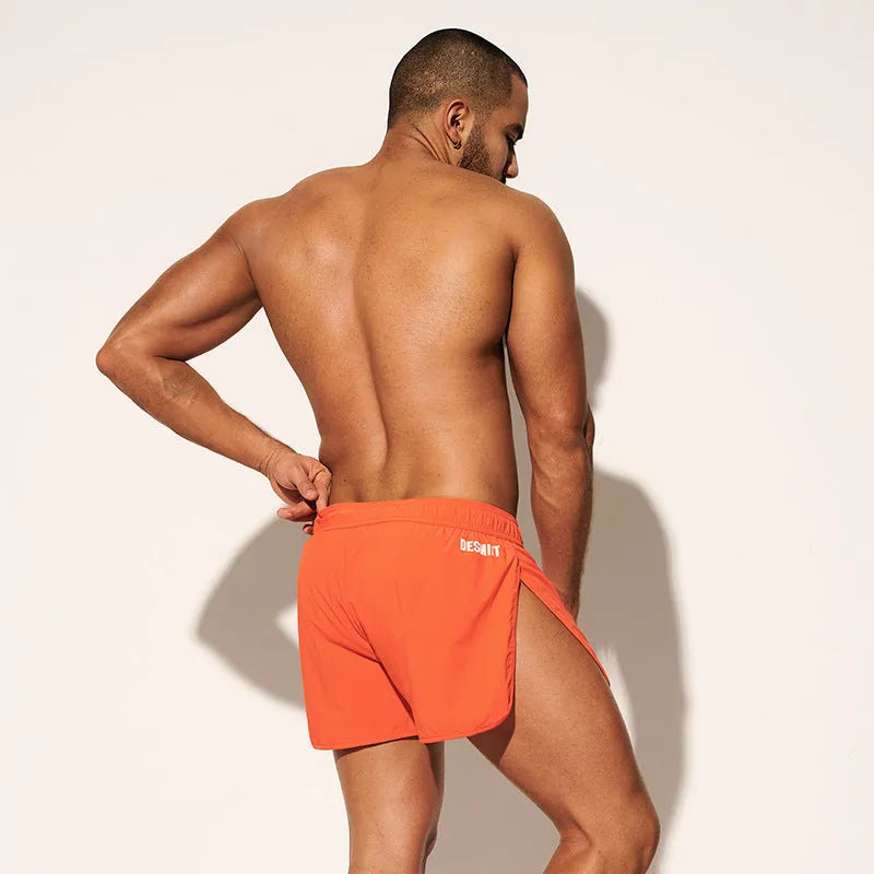 Men's loose beach surfing trousers with elastic waistband in orange red colour