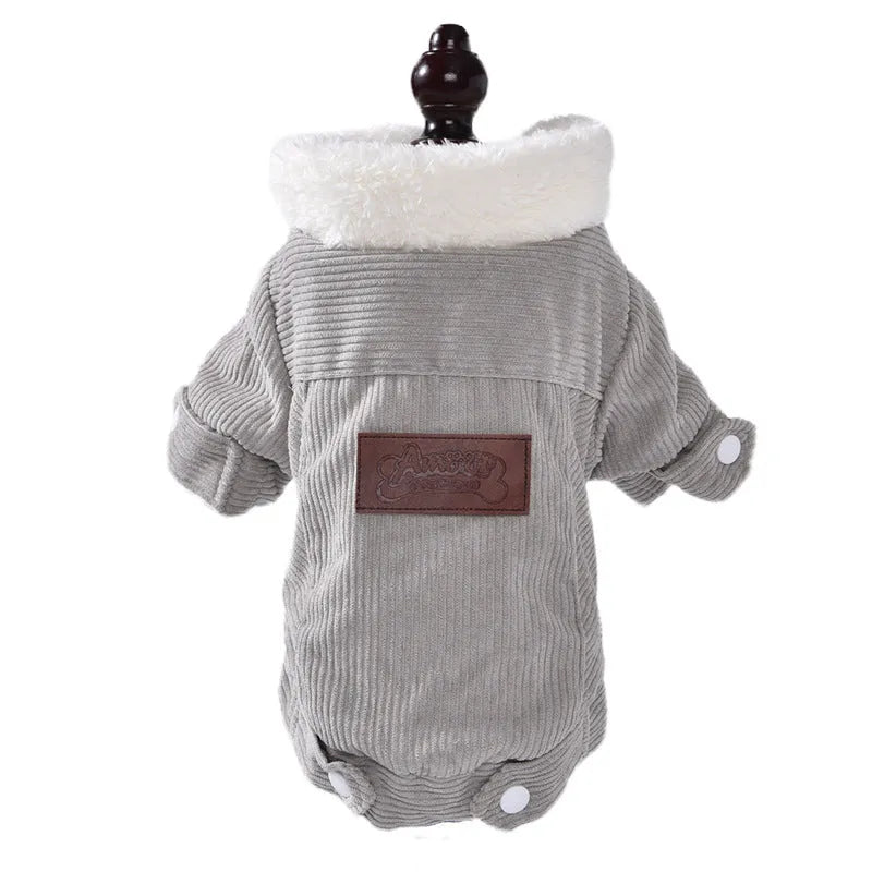 A grey lambswool fleece-lined vest for dogs on a hanger, showing its soft lining and size label.