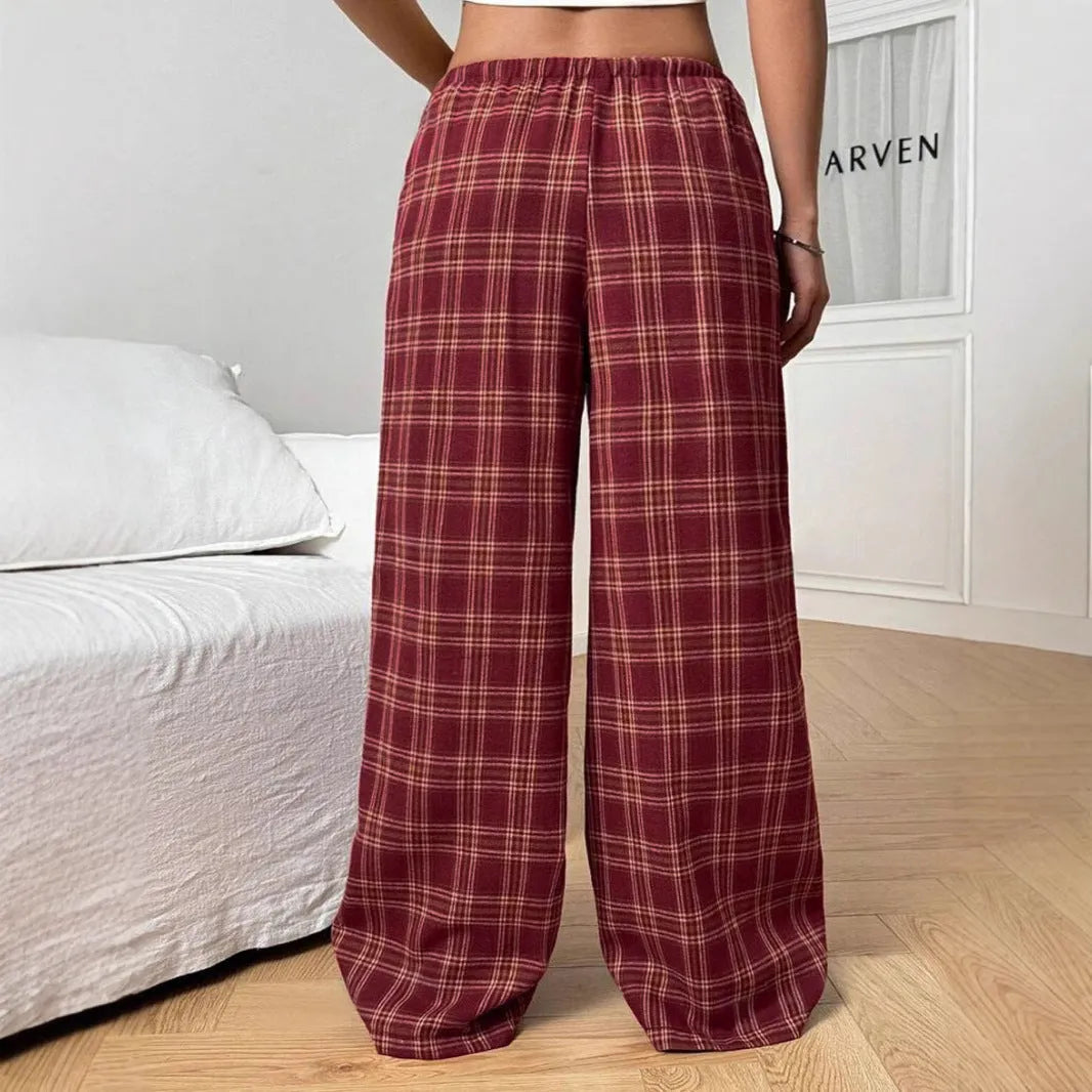 Women's plaid trousers with drawstring waist and side pockets in red or blue colours