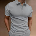 Men's loose fit cotton blend button t-shirt in grey, shown on a hanger.
