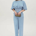 Blue men's polyester casual suit set with long sleeves and trousers on a hanger.