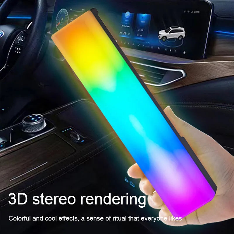 Black and white 3D RGB music rhythm ambiance lamp on a table with USB cable.