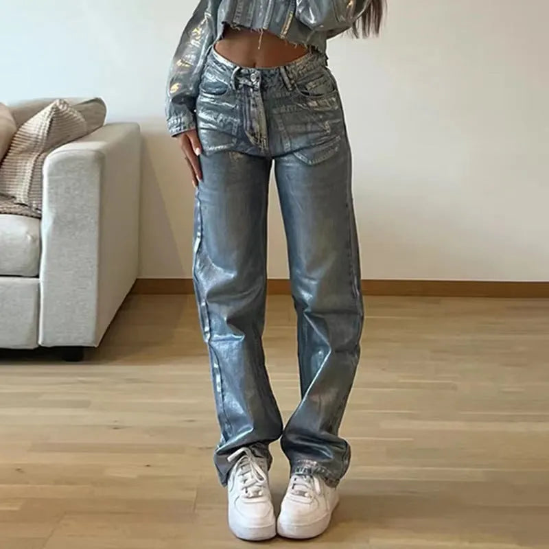 Washed blue high-waist straight-leg jeans with hot silver contrast stitching on a mannequin