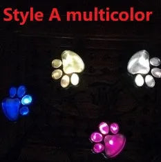 Four black bear paw print solar garden lights with solar panel pole for outdoor path decoration