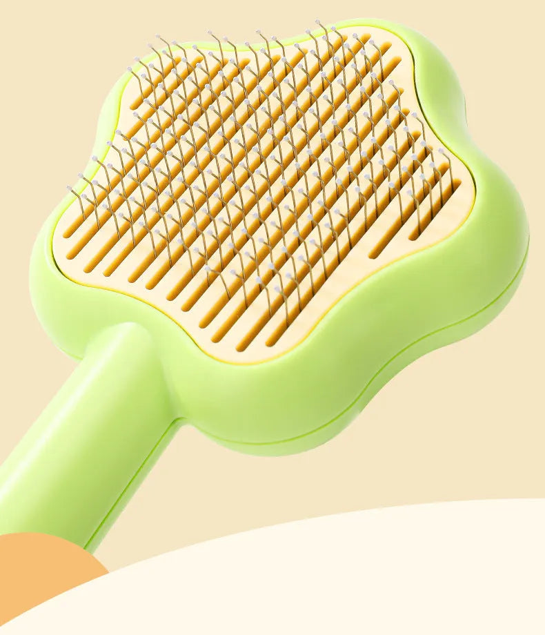Green stainless steel cat grooming comb with self-cleaning mechanism and four rows of needles