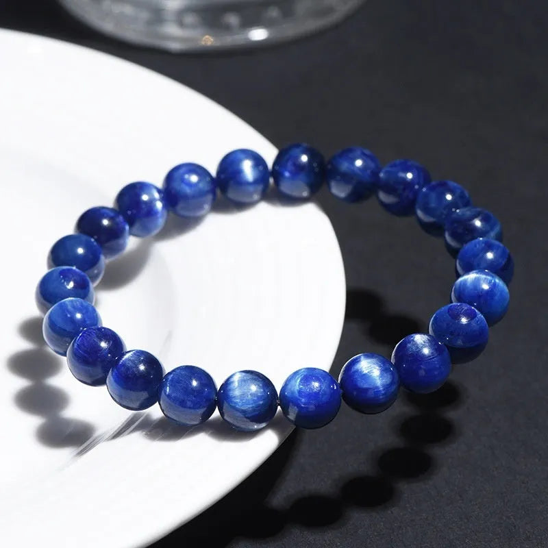 Blue crystal ball bracelet with geometric shape and Ruyi design elements on polished natural crystal