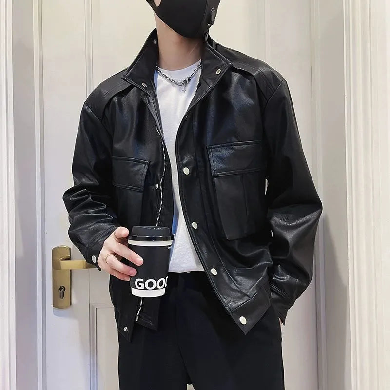 Men's black PU leather pilot jacket with a straight hem and side pocket, laid flat.