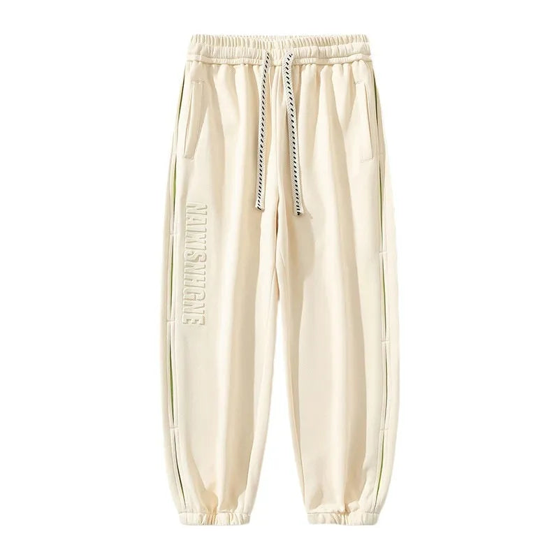 Men's black banded ankle cotton trousers with stitching detail and loose fit design