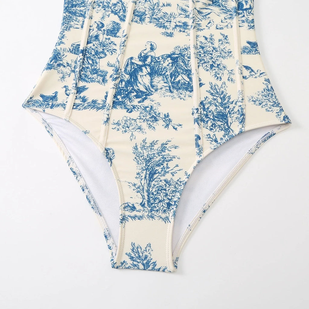 Blue women's one-piece swimsuit with matching gauze skirt on white background