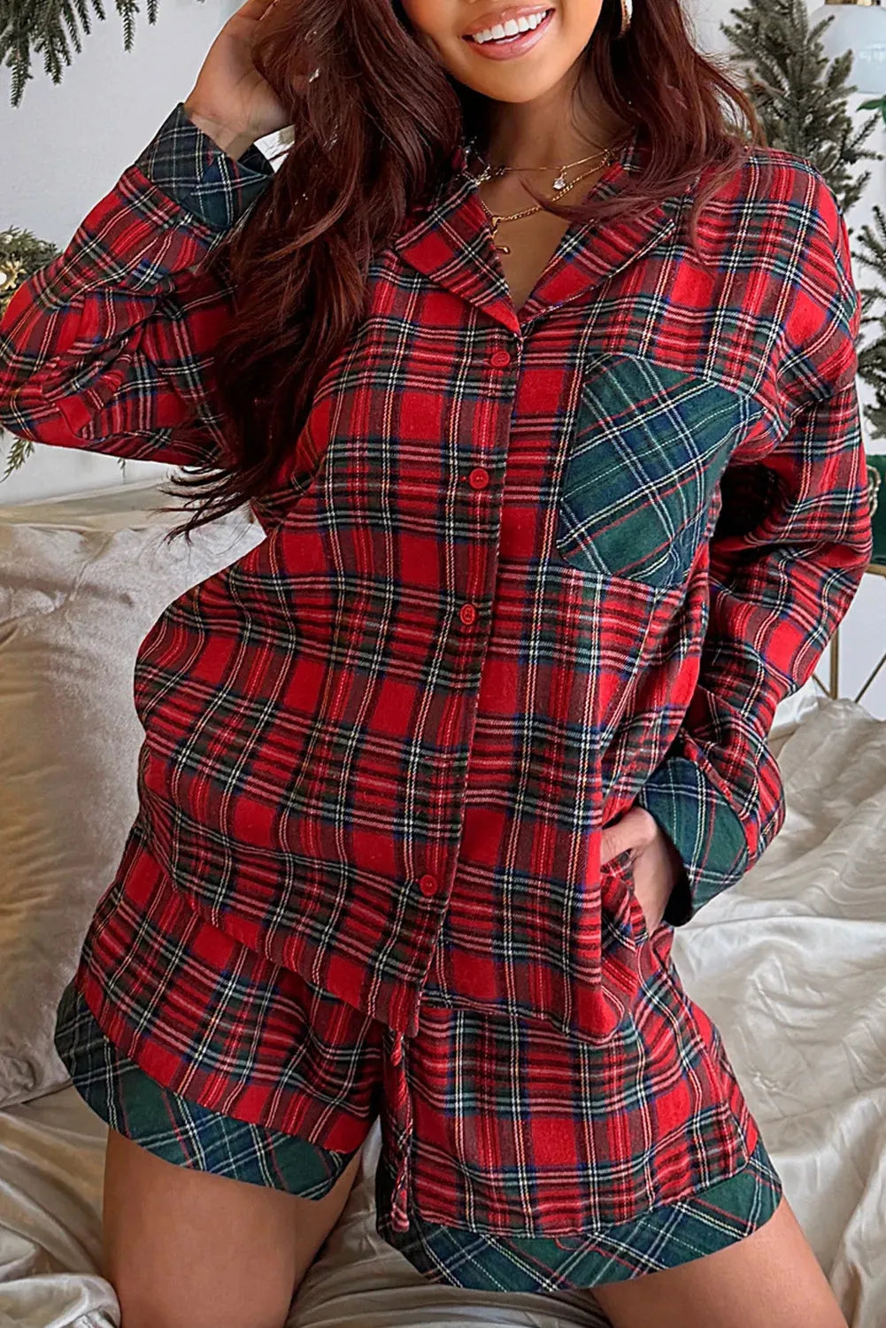 Red plaid Christmas pyjama set with long sleeve shirt and shorts featuring contrast patches