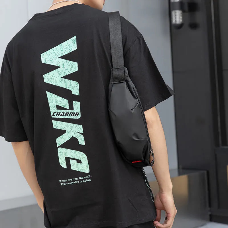 Black Oxford cloth waist pack with crossbody strap showing phone and ID pockets