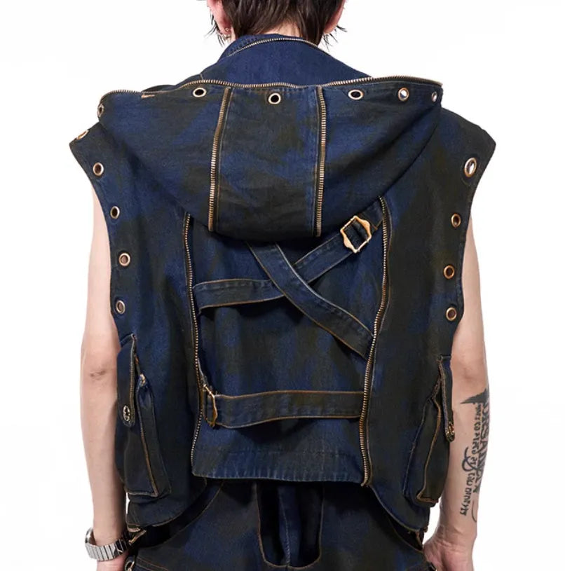 Blue heavy industry style hooded denim vest coat with matching trousers laid flat.