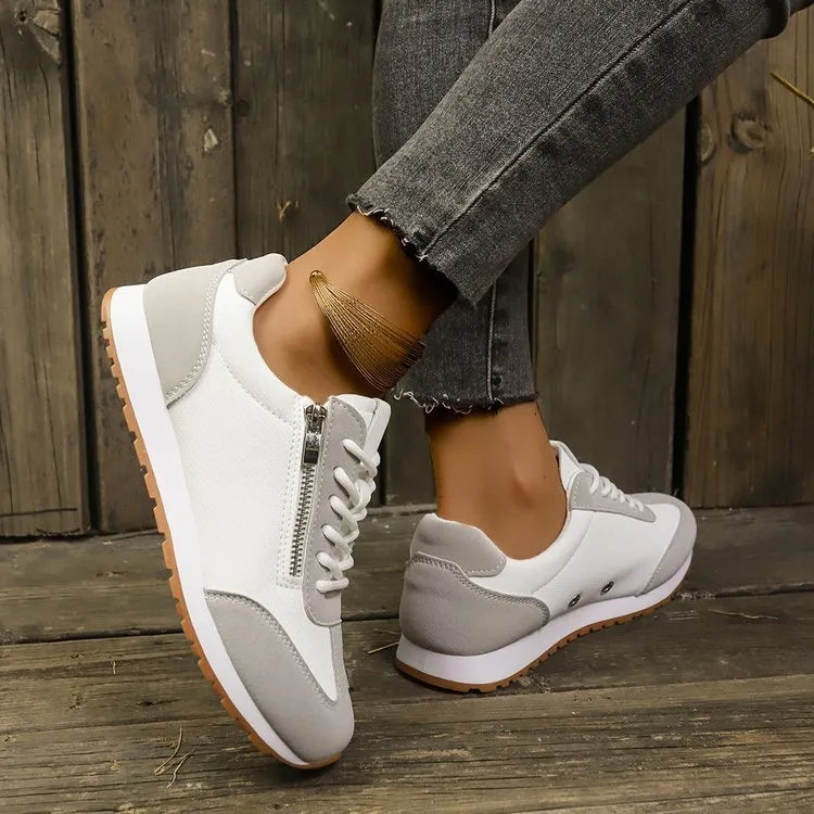 Women's flat-heeled shoes in champagne, grey, and white colours with synthetic PU upper and rubber sole