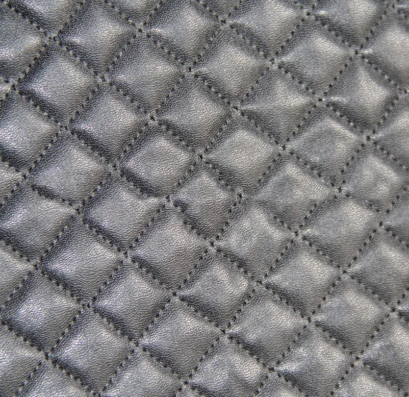 Black quilted universal car seat cover made from PU and polyester fabric.