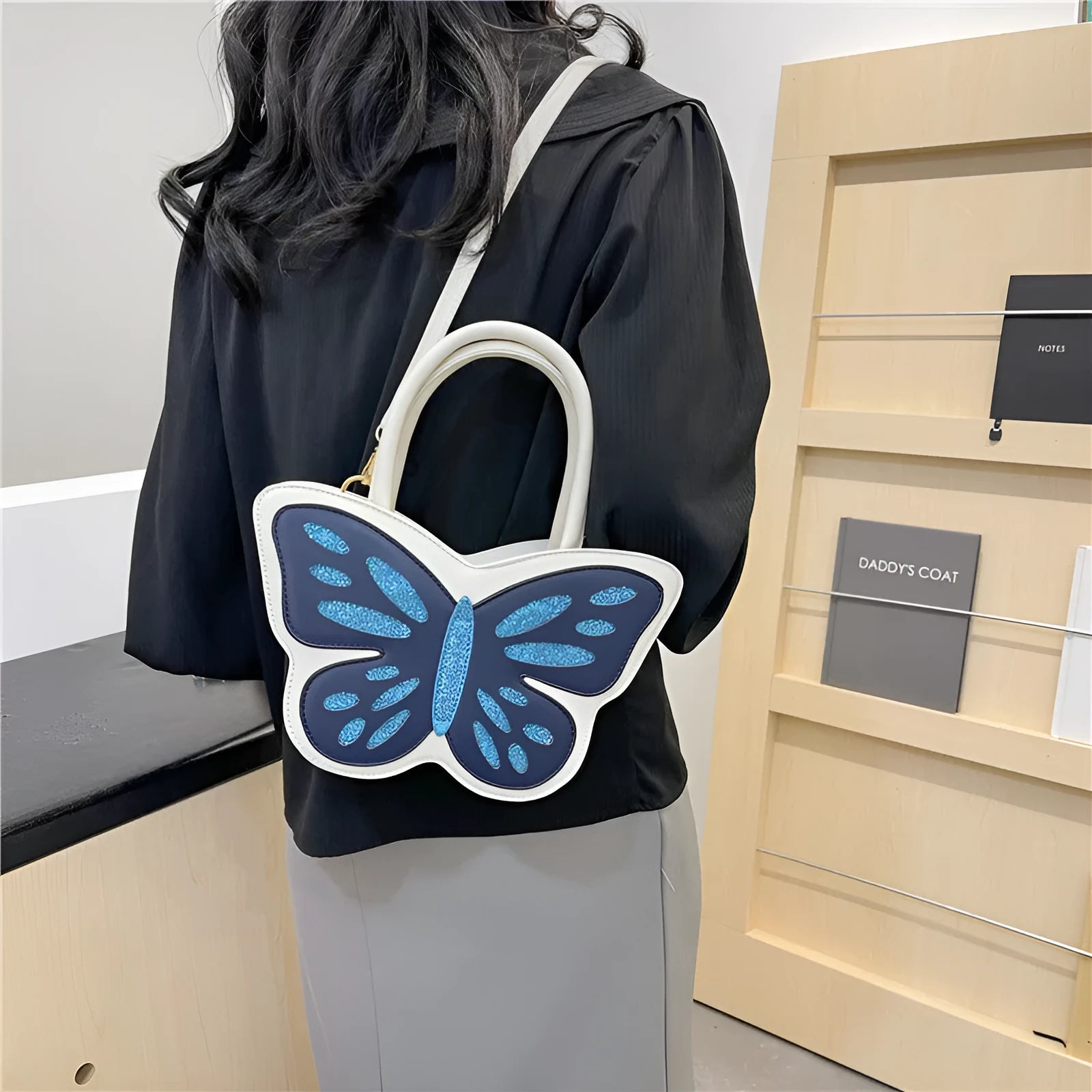 Square-shaped crossbody bag in PU leather with contrast detailing showing front view