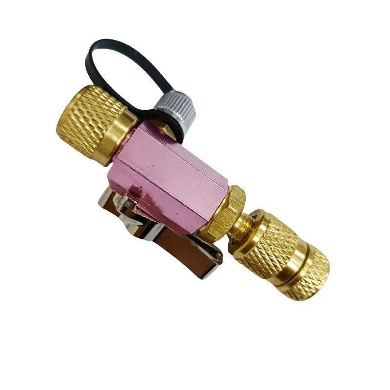 Metal valve core removal tool set for bicycle tyres in black and pink with 1/4 inch and 5/16 inch sizes.