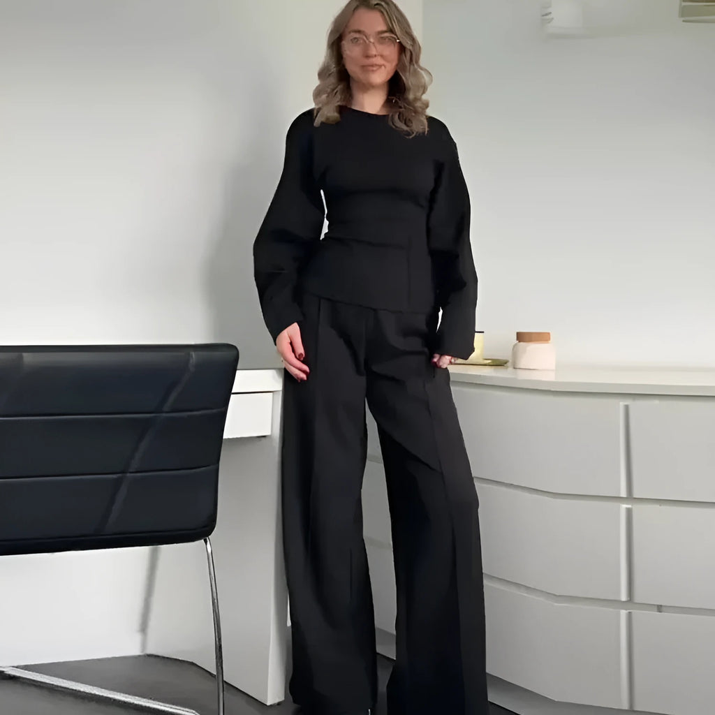 Women's black polyester fleece long sleeve top and wide leg pants two-piece suit set with pockets.