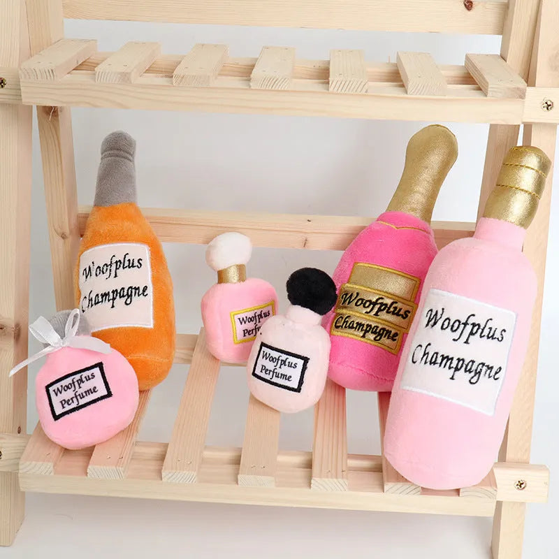 Soft plush pet toy shaped like a wine bottle in assorted colours including green, red, and black.
