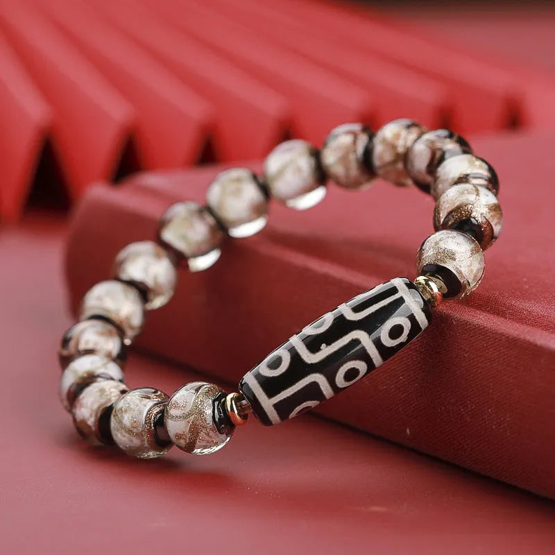 Handmade coloured glaze bracelet with auspicious patterns and year snake motif in Chinese style