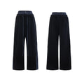 Men's black hooded short sleeve polyester sports suit with textured stitching and matching trousers on a grey background.