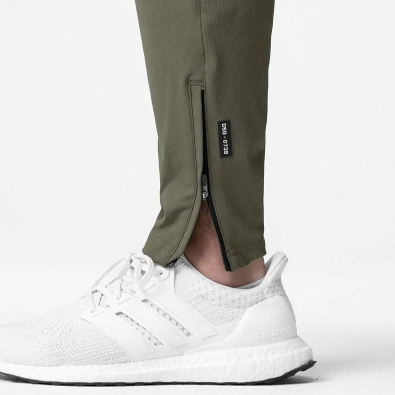 Men's grey quick-dry fitness pants with ankle ties in loose casual style
