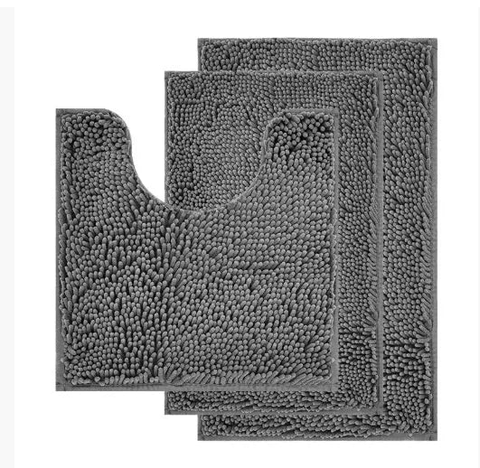 Dark green chenille three-piece U-shaped toilet mat set with non-slip TPR backing on bathroom floor.