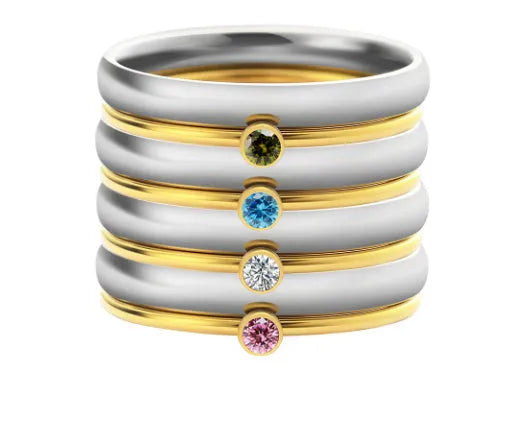 December birthstone titanium steel ring with engraved geometric pattern on a hand.