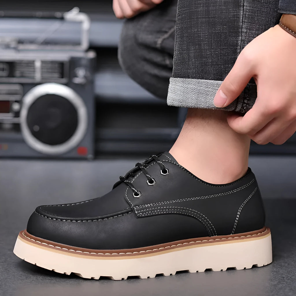 Men's black retro low-top Martin boots with a round toe and mid-height heel on a rubber sole.