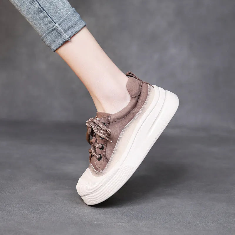 Yellow women's leather lace-up casual shoes with round toe on a plain background.