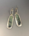 Geometric two-colour marble pattern alloy earrings on a white background.