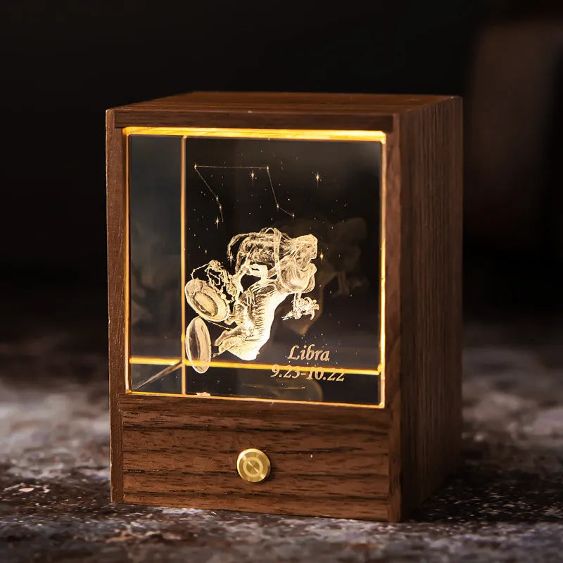 Crystal LED table lamp with black walnut base and K9 crystal showing constellation night light effect