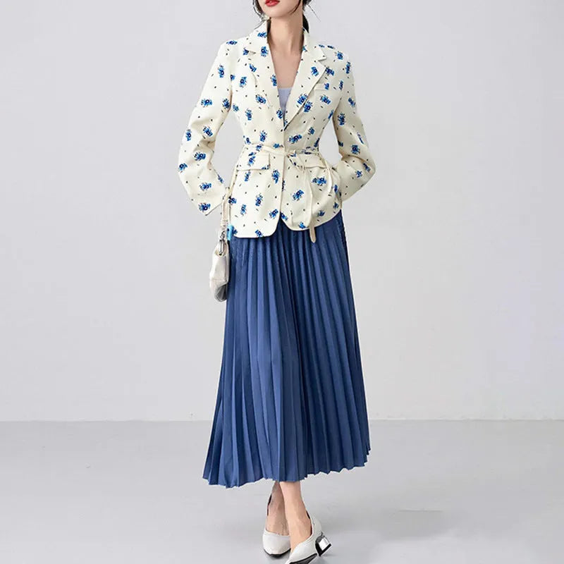 Women's floral print suit jacket with lace-up waist closure on a hanger.