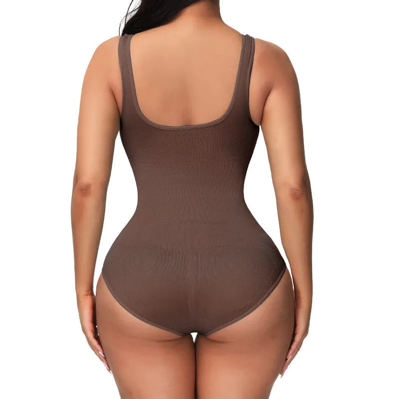 Seamless women's bodysuit shapewear in apricot colour on a hanger, showing its one-piece design.
