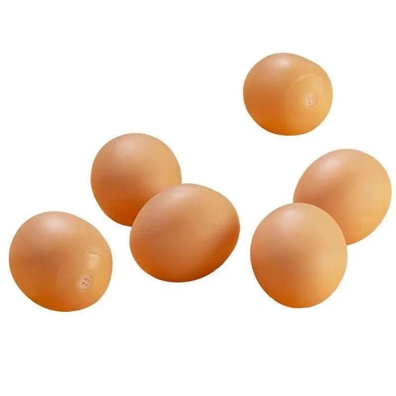 White simulation egg dog toy with textured surface for squeaking sound and tooth cleaning