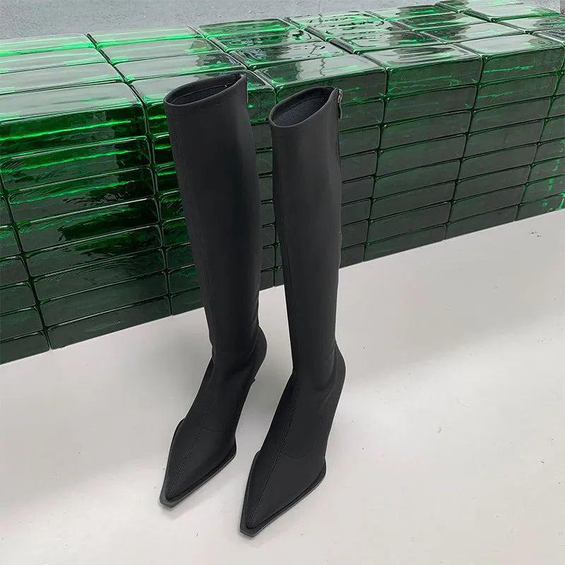 Women's black pointed toe ankle boots with a stiletto heel and a back zipper fastening.