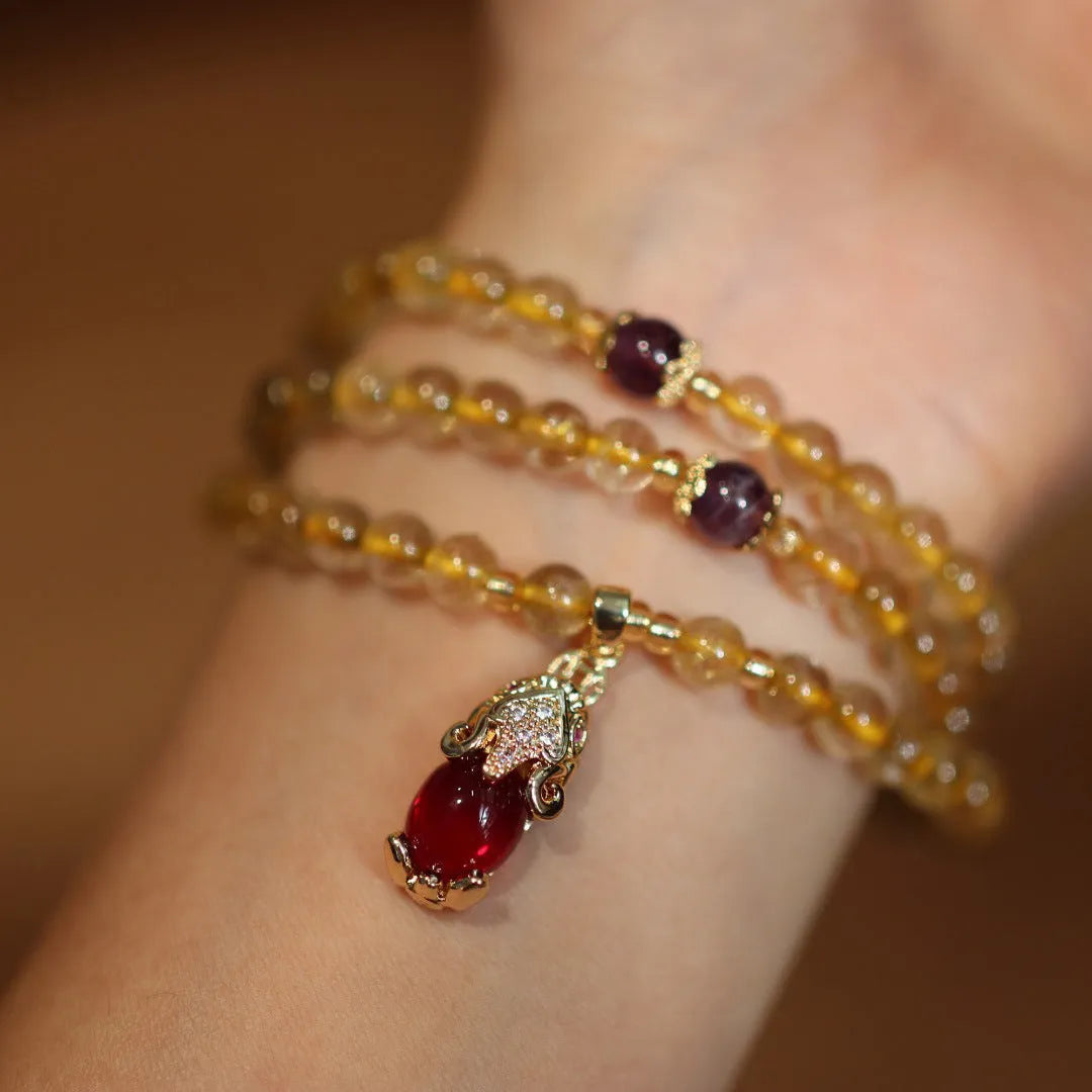 Natural Brazil gold rutilated quartz bracelet with three gold circles and ruby quartz charms in Chinese style